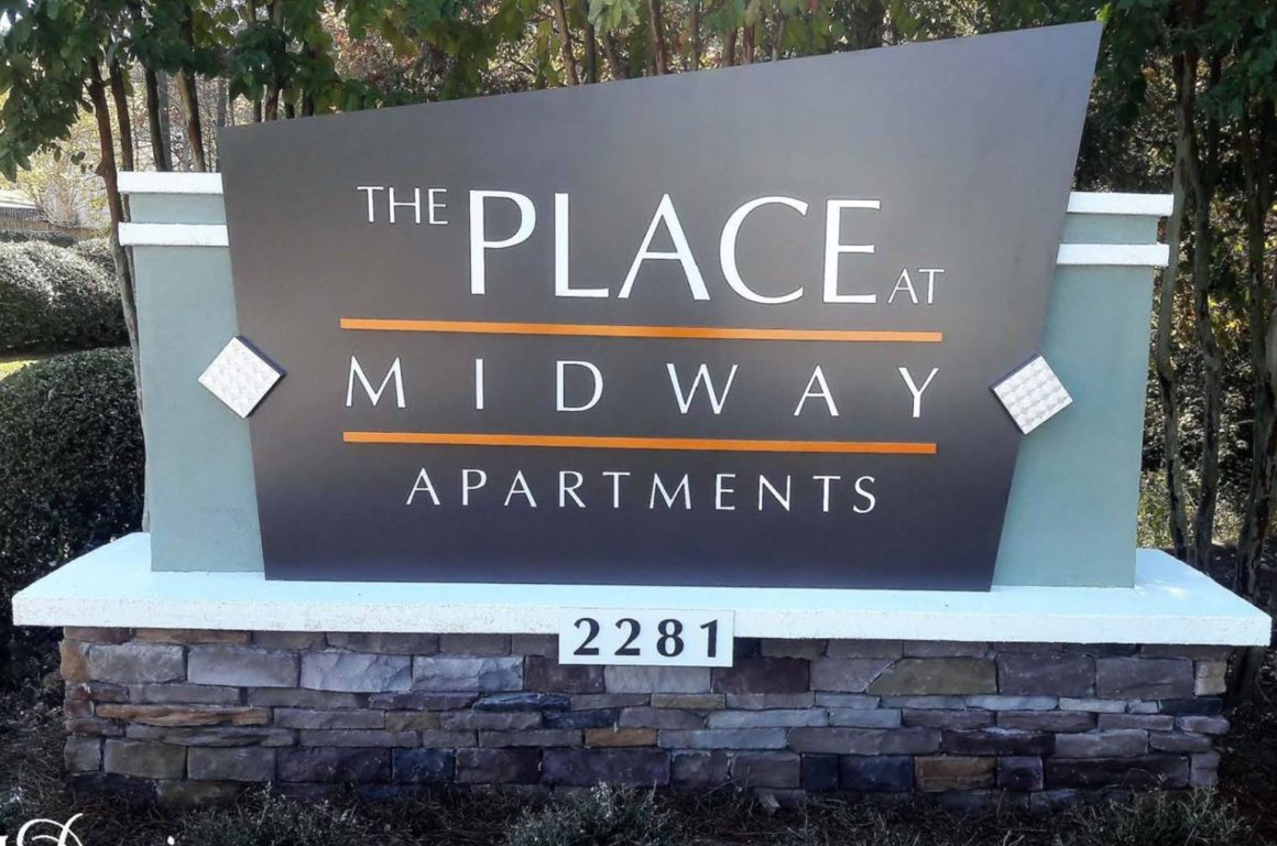 The place at midway apartment ID sign